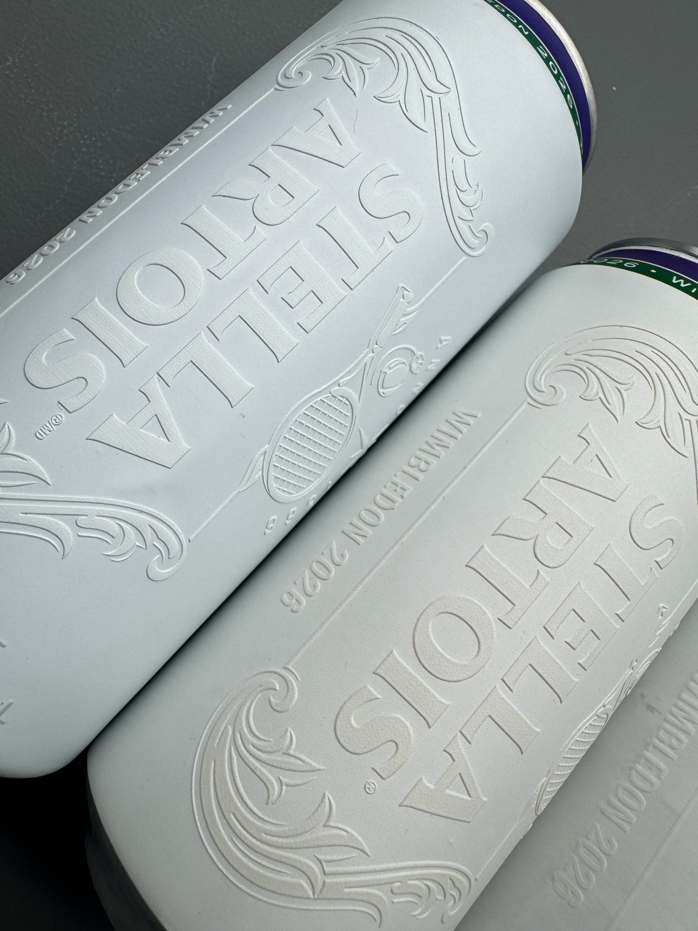 Finished cans showing the high-build embossed varnish
